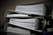 Stack of binders with papers inside