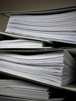 Stack of binders with papers inside